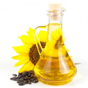 Sunflower with seeds and oil on a white background